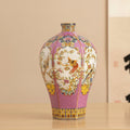 Front view of pink porcelain faceted vase with bird and flower motifs