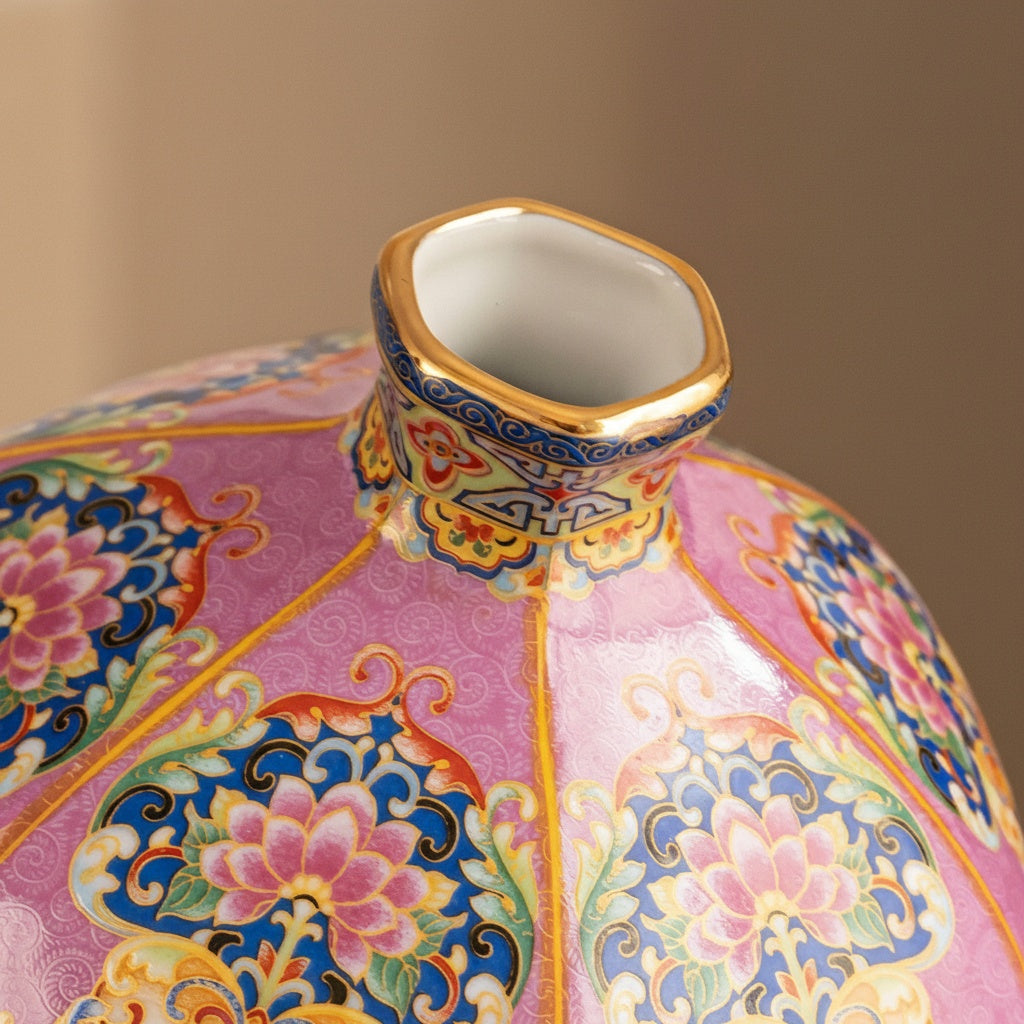 Detail shot of gold rim and floral patterns on porcelain vase neck