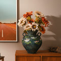 Front view of hand-painted floral vase with sunflowers