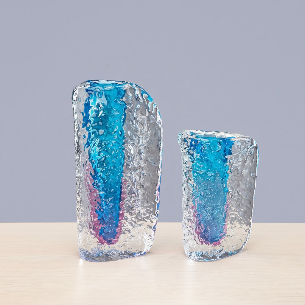 Pair of large and medium ice textured glass vases side by side