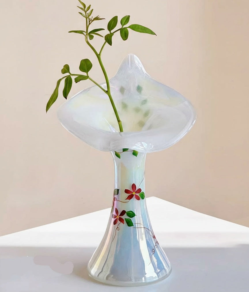 Detail of ruffled rim on iridescent glass floral vase