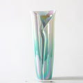 Angled view of sculptural pearlescent vase