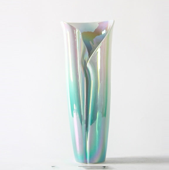 Angled view of sculptural pearlescent vase