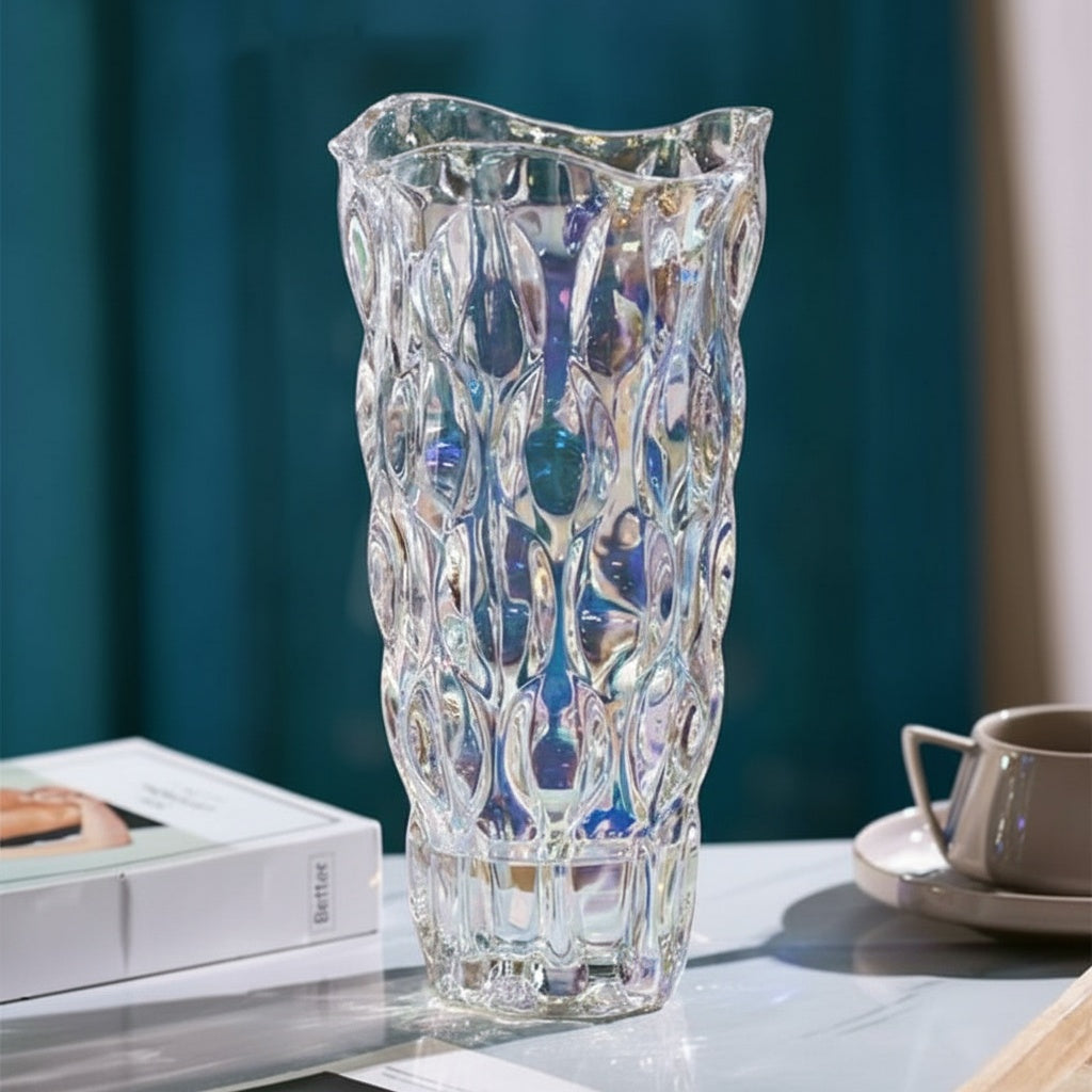 Iridescent textured glass vase catching light on a table