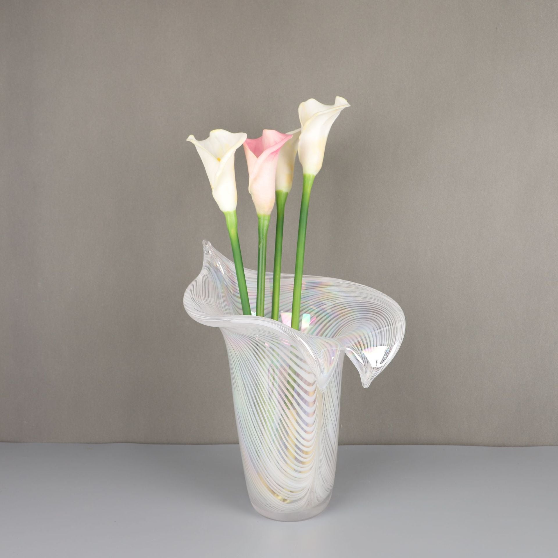 Front view of white art glass vase with ribbed texture