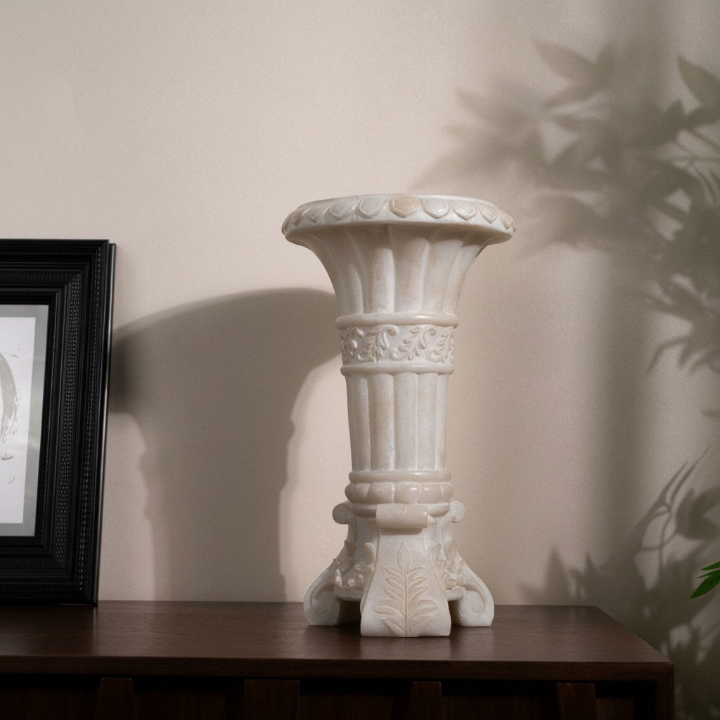 Ivory Carved Stone Pedestal Vase on dark wood console