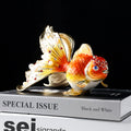 Red and gold enamel goldfish figurine front view