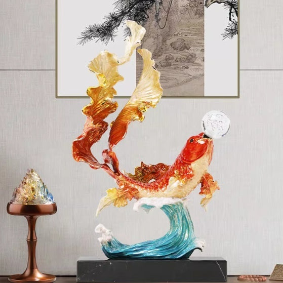 Front view of leaping koi fish sculpture with crystal ball