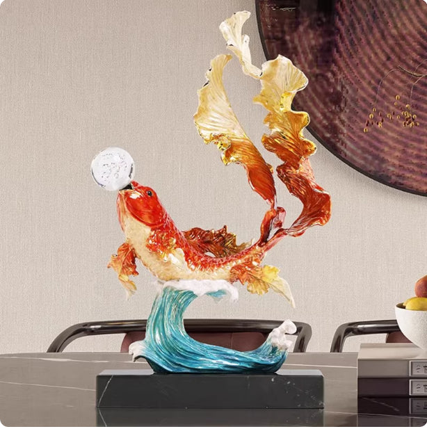 Angled view of koi fish sculpture showing wave base details