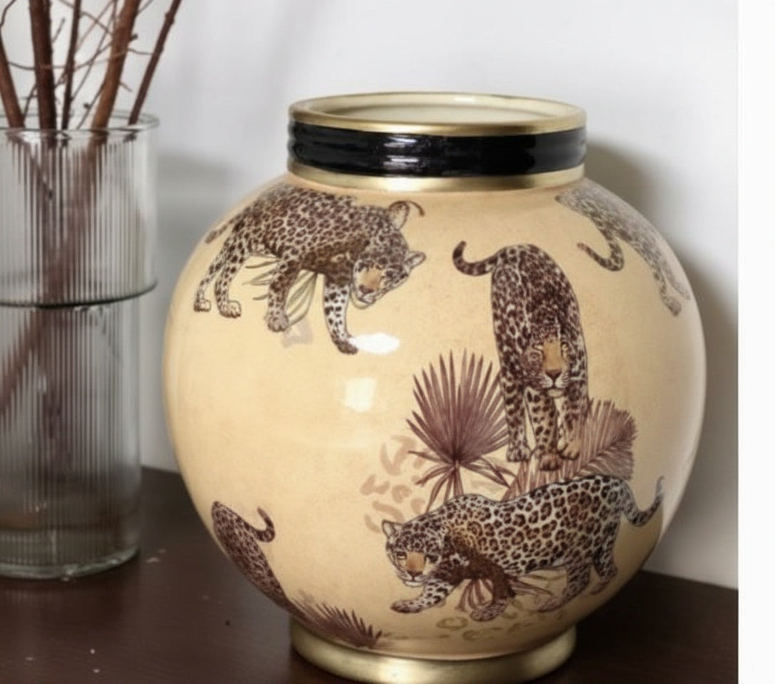 Side angle of ceramic vase showing leopard and palm motif