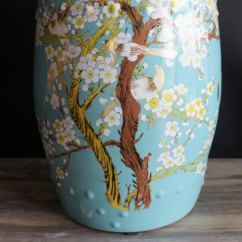 Close up detail of gold accents on bird and floral pattern