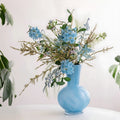 Light Blue Glass Bulbous Vase with Floral Arrangement