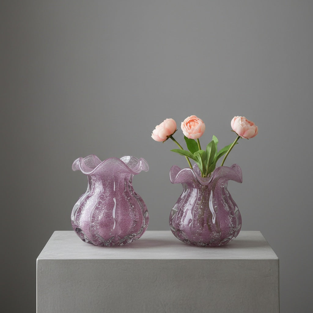 Two lilac bubble glass ruffled vases on white table