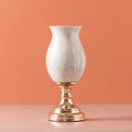Tall marble pattern ceramic pedestal vase on a glossy gold-tone base