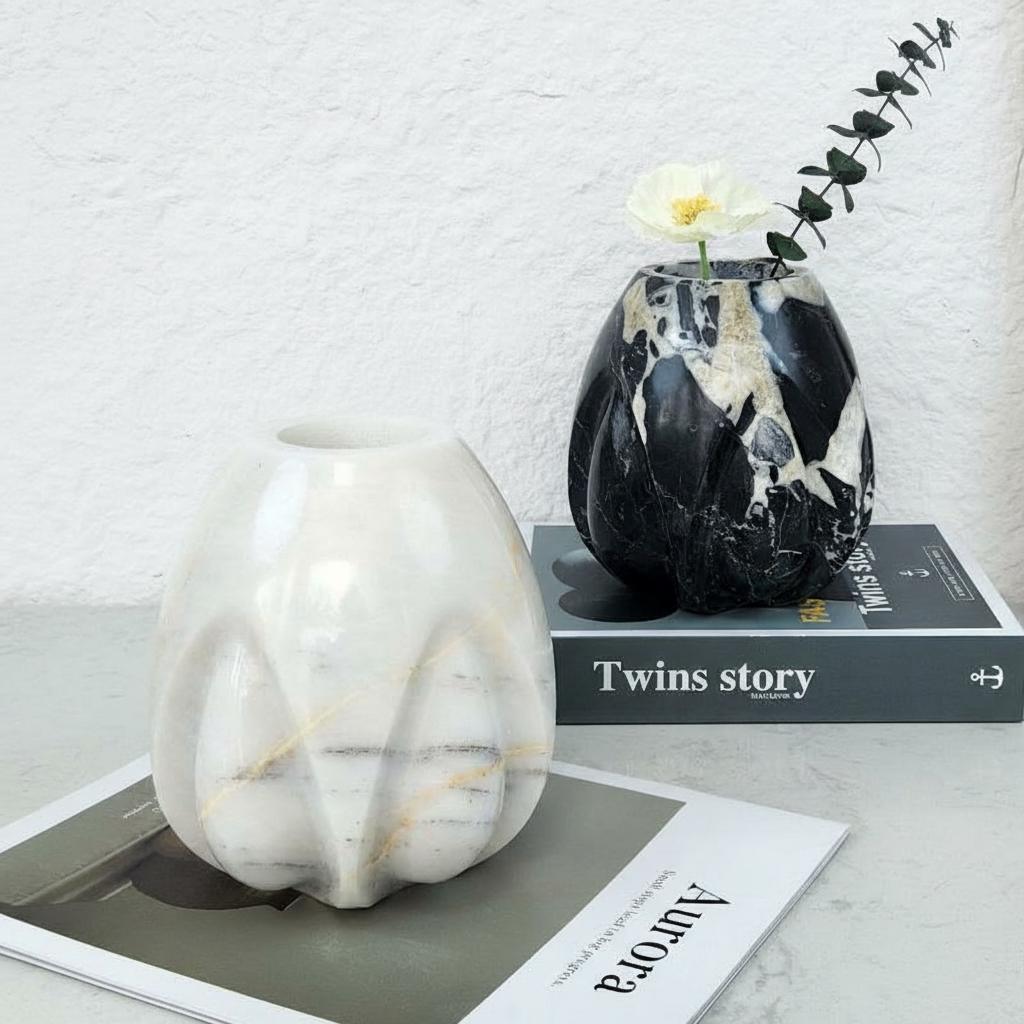 White and black marble fluted vases styled with flowers