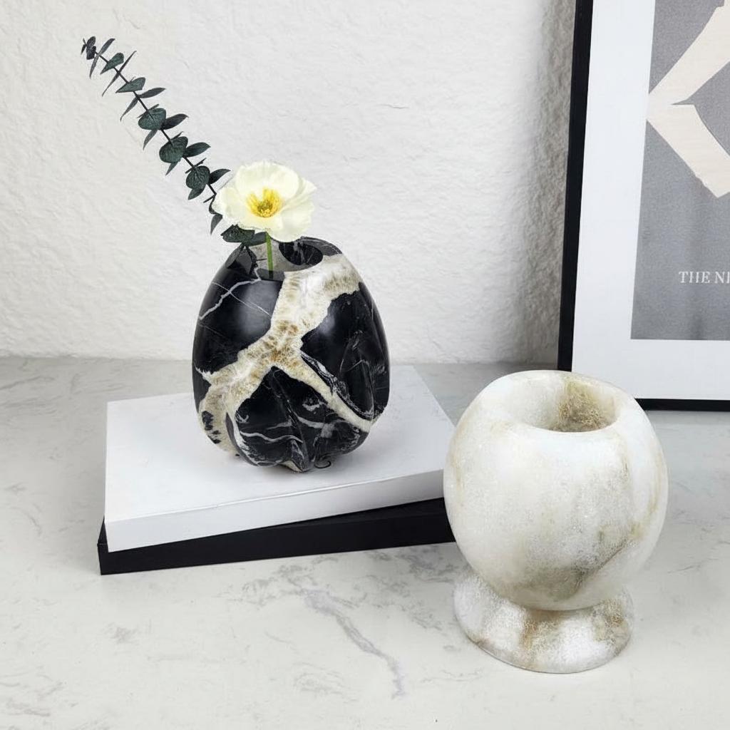 Pair of marble vases styled on books