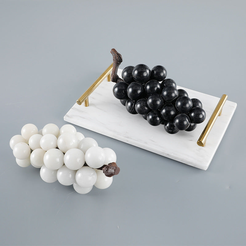 Angled view of marble fruit decor on table setting
