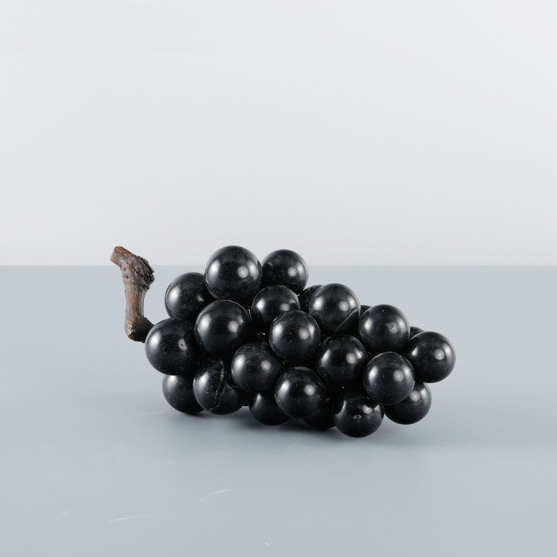 Side view of black marble grape cluster sculpture