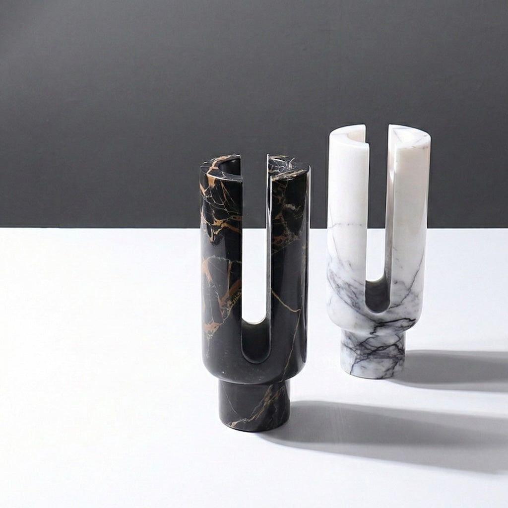 Two marble candle holders black and white standing together
