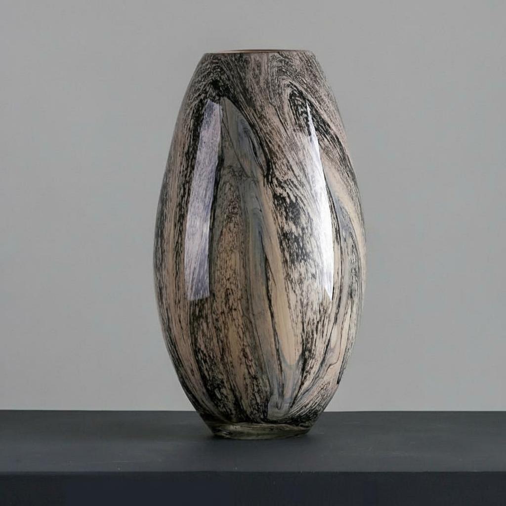 Front view of tall tapered marbled glass vase