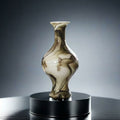 Front view of marbled glass baluster vase on pedestal