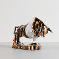 Glossy marbled resin charging bull sculpture side view