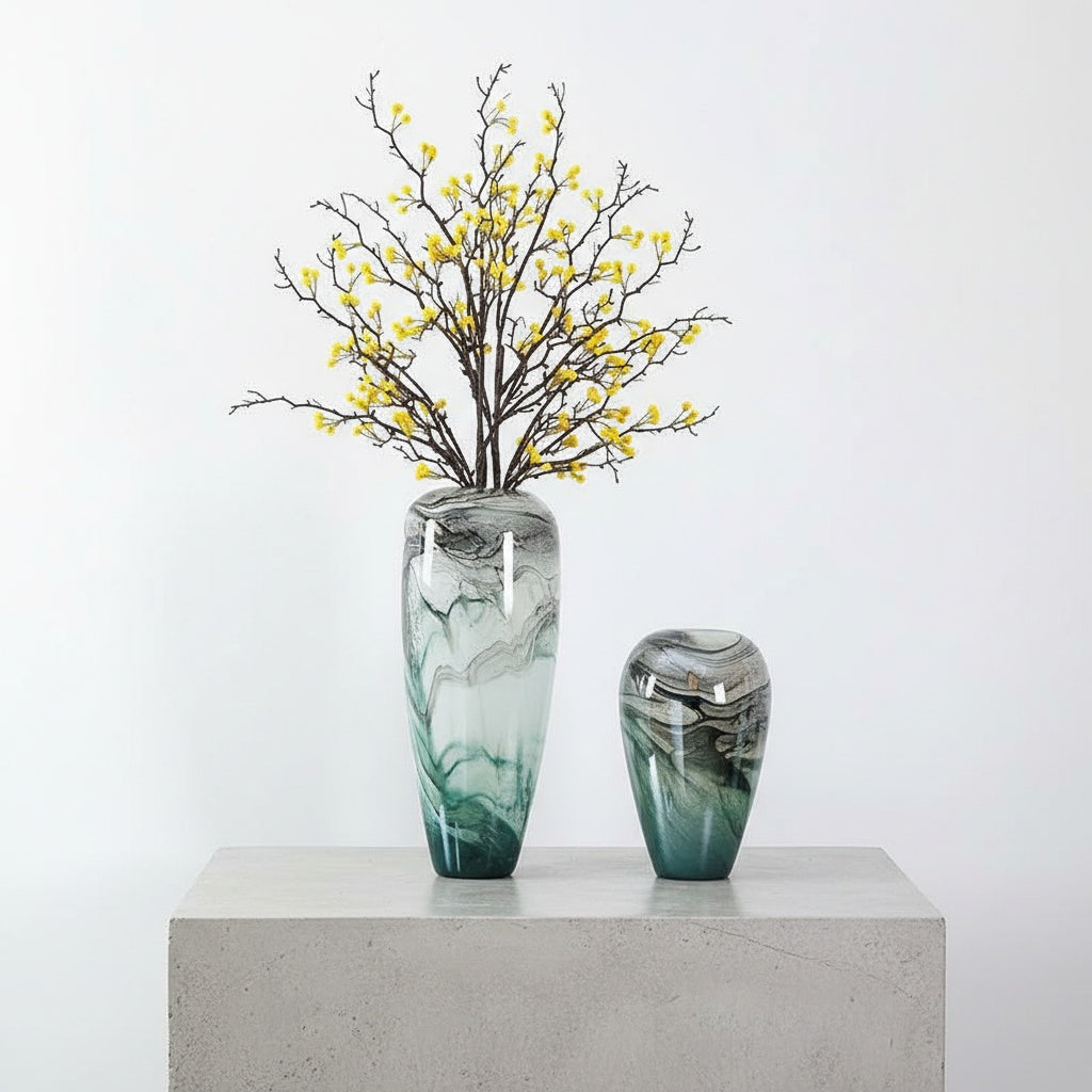 Teal and white swirled glass vases with yellow berry branches