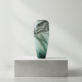 Tall cylinder glass vase with teal and grey marble pattern
