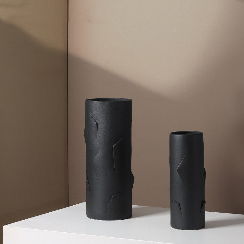 Close up of medium and large black ceramic vases