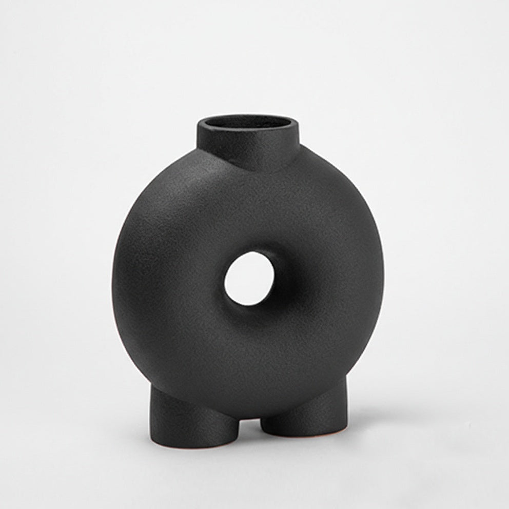 Matte black ceramic standing donut vase front view