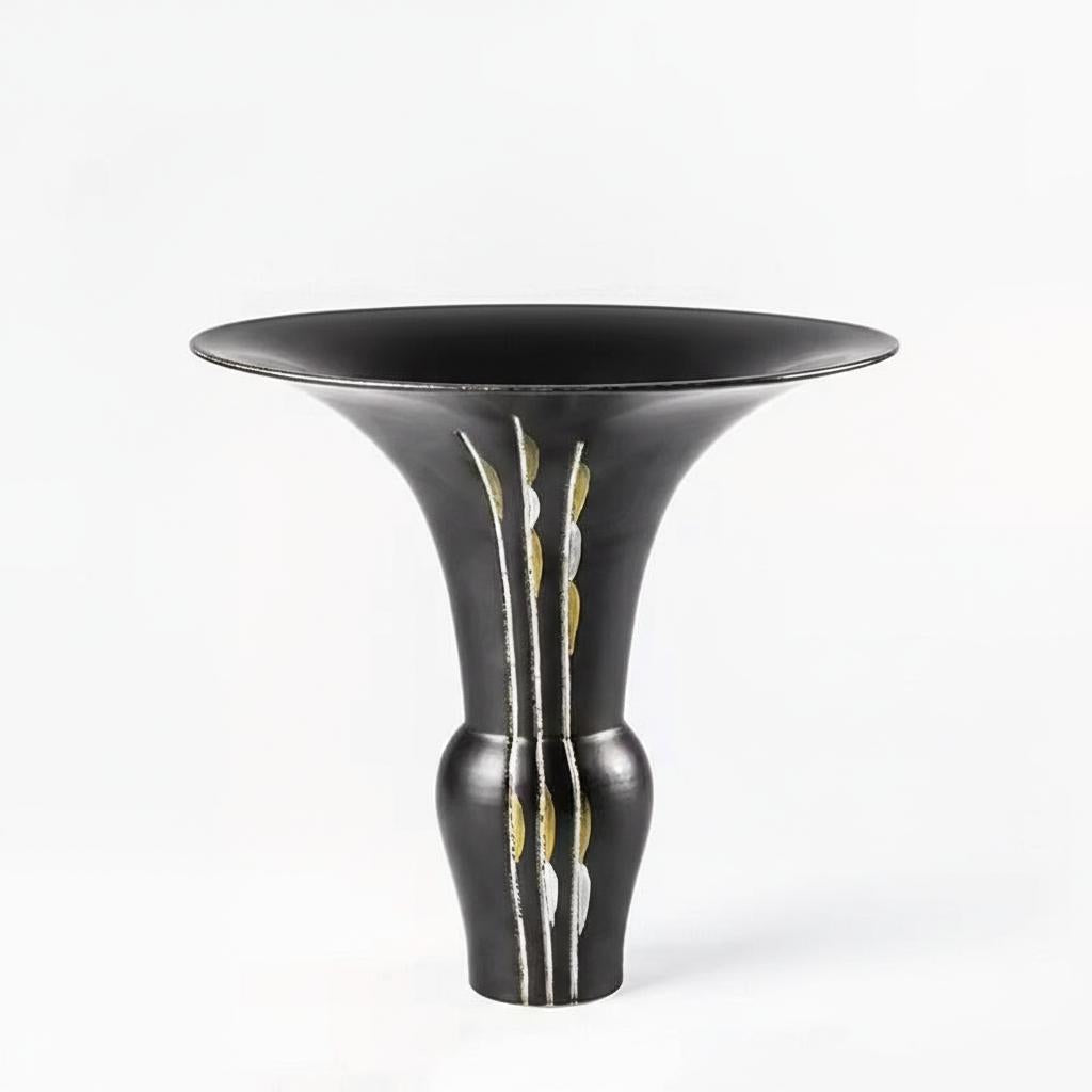 Studio shot of matte black ceramic vase with flared rim