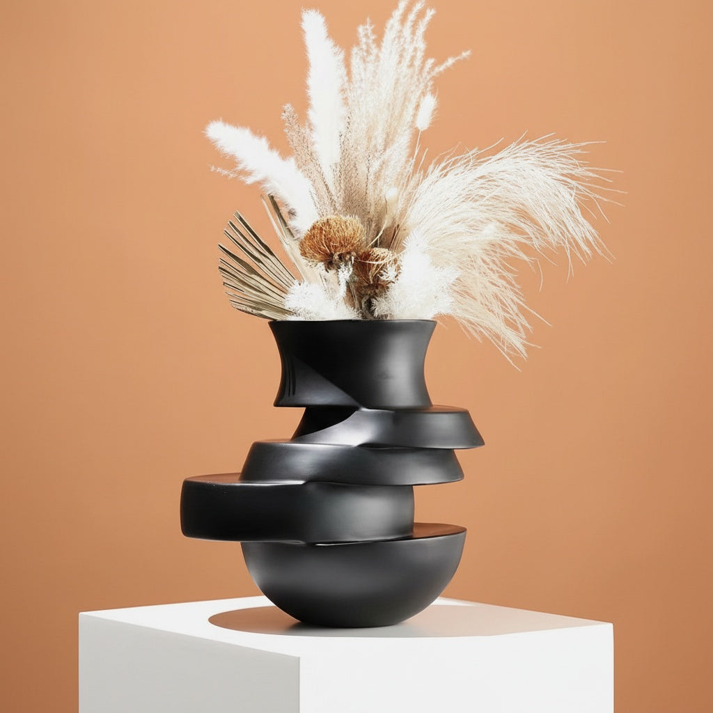 Matte black stacked sculptural vase with offset layers