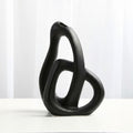 Close up of black matte ceramic sculptural curve