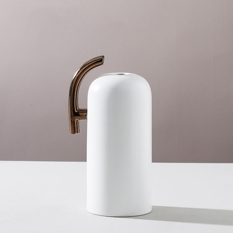 Tall white ceramic vase with bronze handle