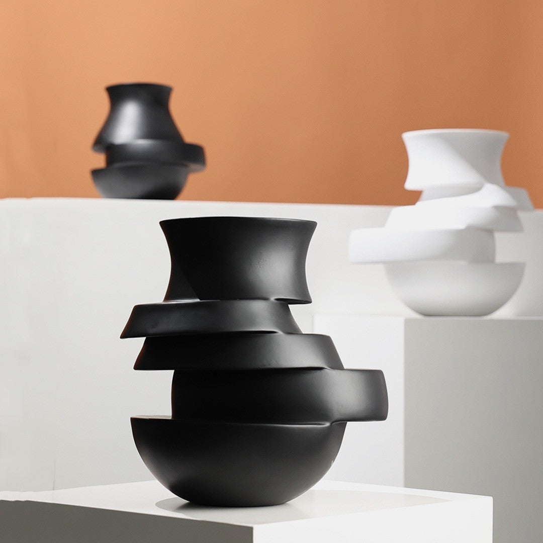 Black and white sculptural vases on display