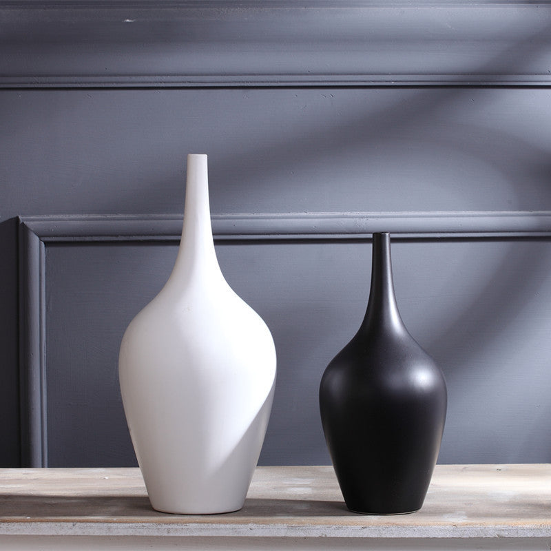 Pair of minimalist matte ceramic vases in black and white