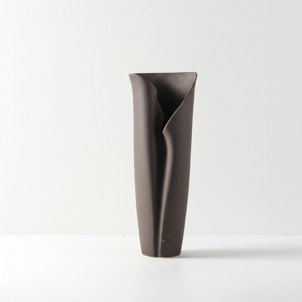 Large sculptural ceramic vase with matte dark finish