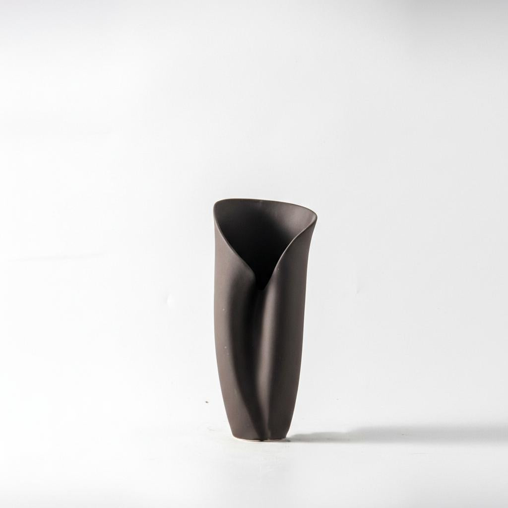 Angled view of modern folded ceramic vase