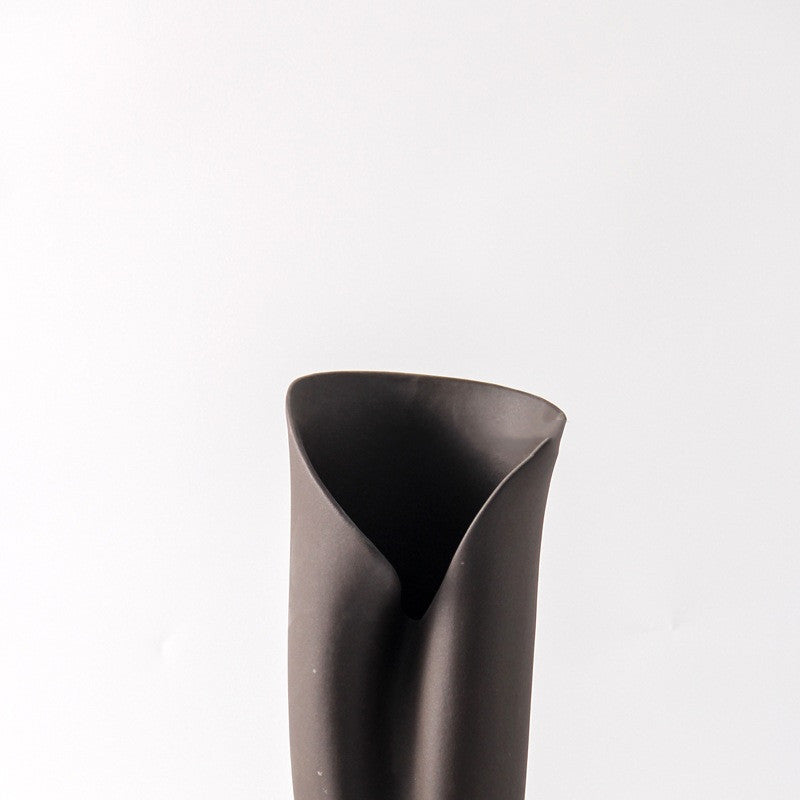 Close up detail of folded vase rim and matte texture