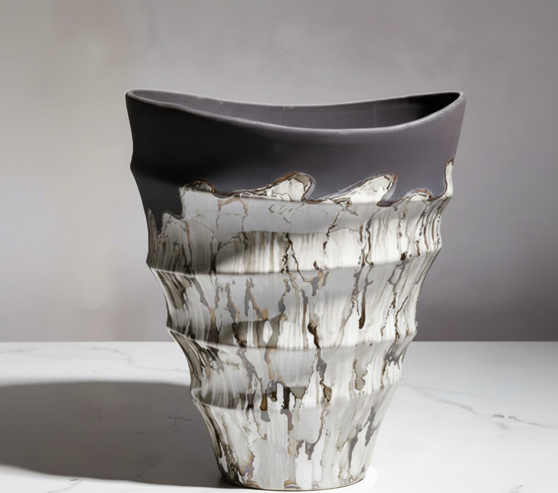 Detail of textured silver glaze on charcoal ceramic vase