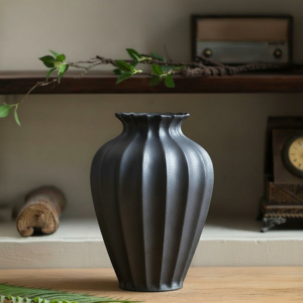 Matte Graphite Ceramic Fluted Vase on wooden surface