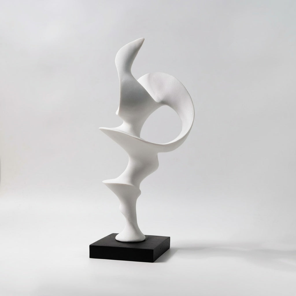 Matte White Abstract Sculpture with black base against white background