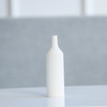 Empty matte white ceramic bottle vase close up