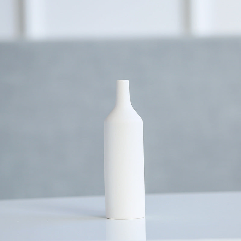 Empty matte white ceramic bottle vase close up