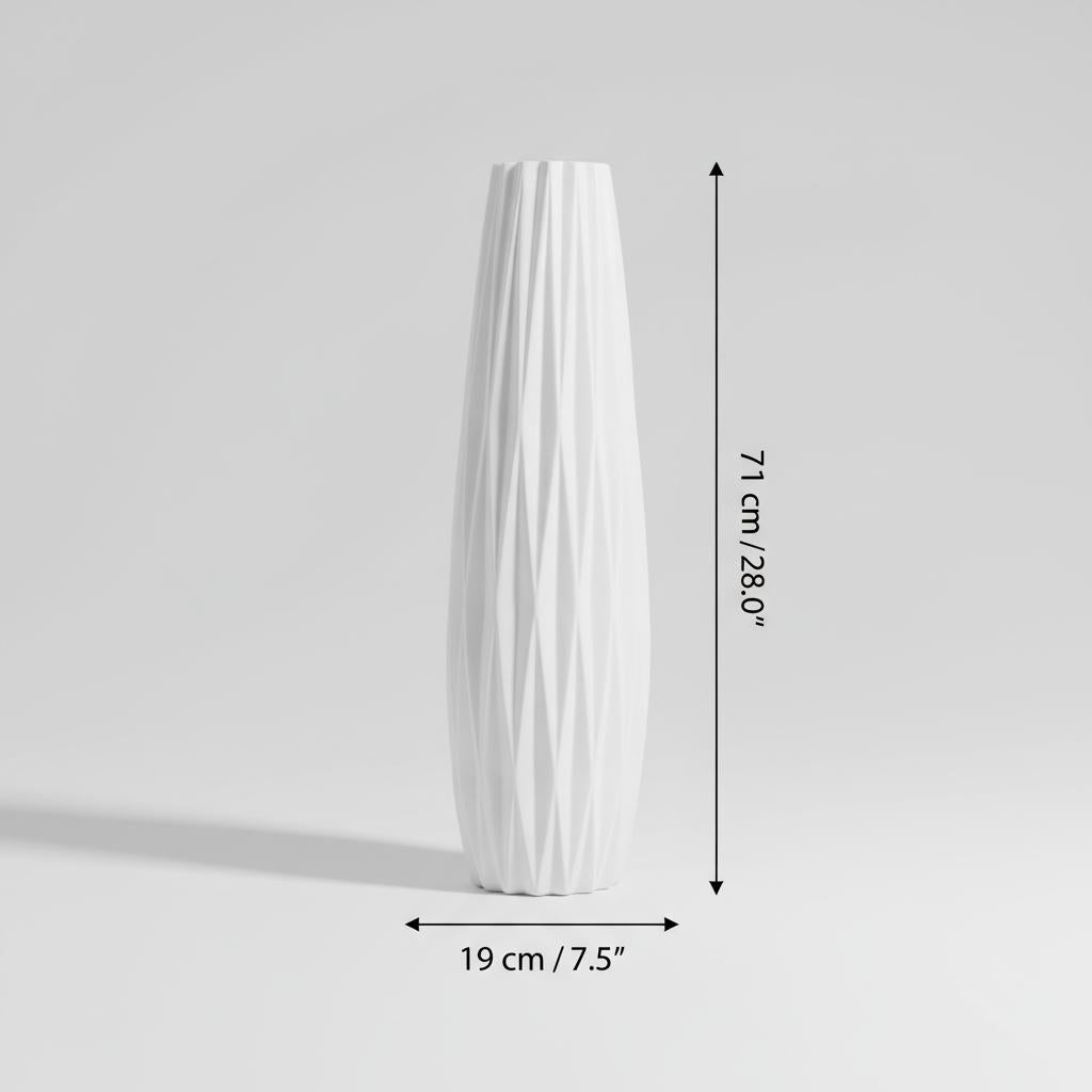 Two white faceted vases displayed with pink floral arrangement