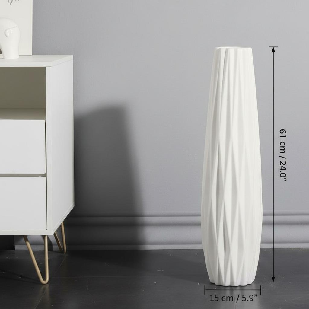 Single tall white floor vase against grey wall