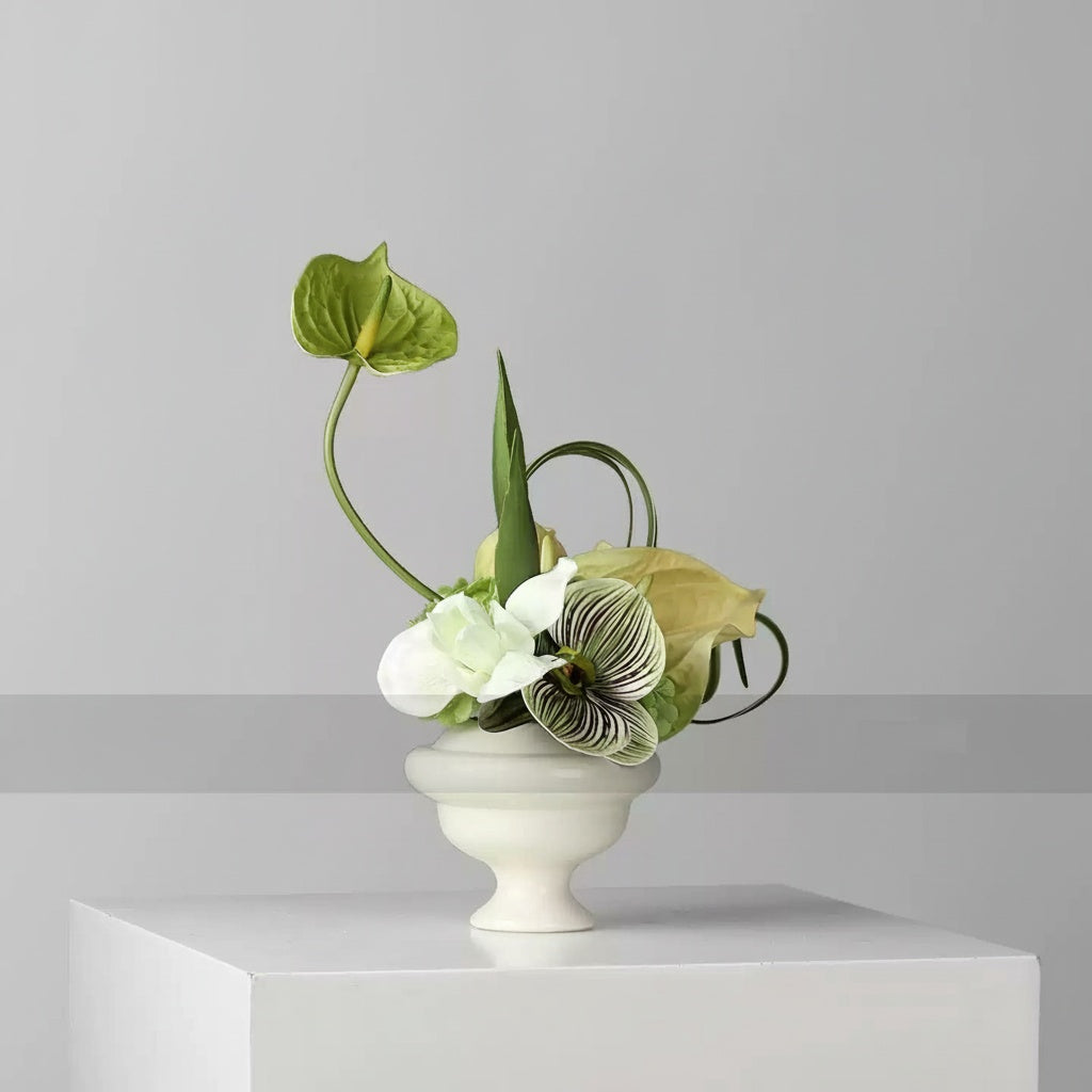 Matte White Ceramic Footed Vase with Floral Arrangement