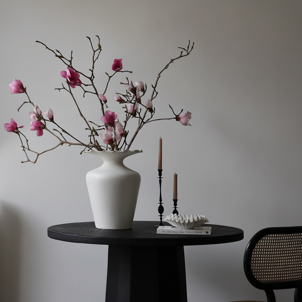 Matte White Ceramic Ruffled Rim Vase on Black Table