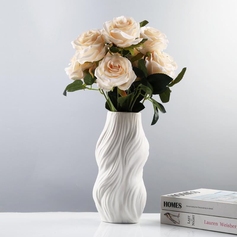 White textured vase styled with cream roses
