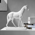 Side view of large white resin horse statue